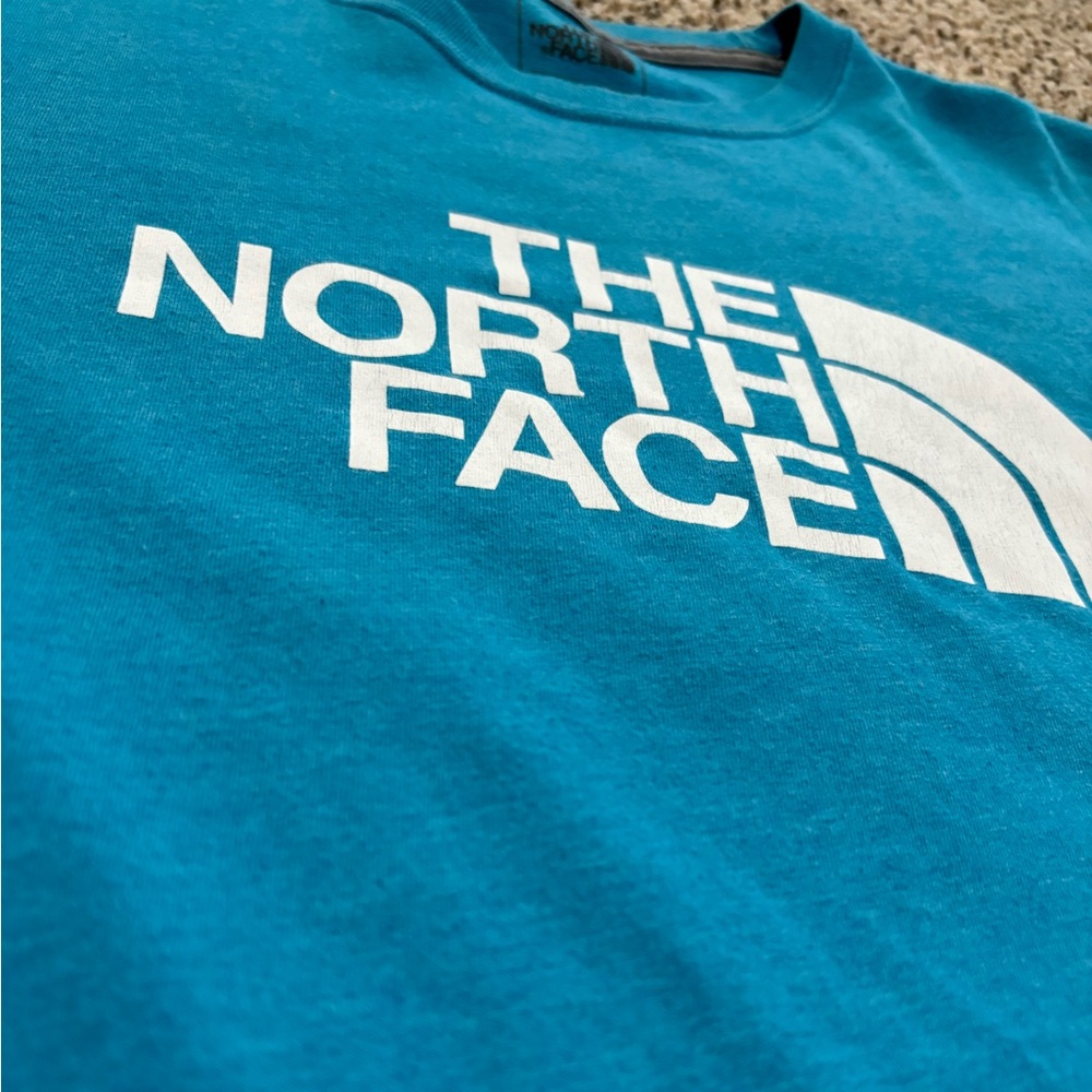 The North Face shirt size medium.